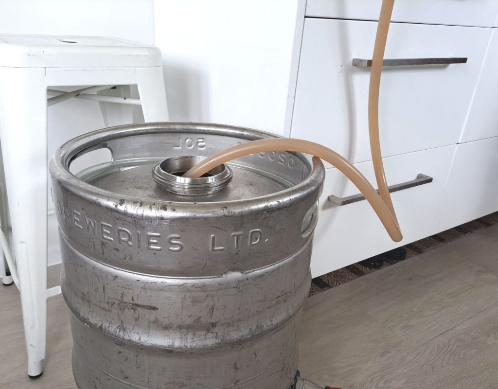 Image of DIY Distilling Filling the fermenter with whiskey wash