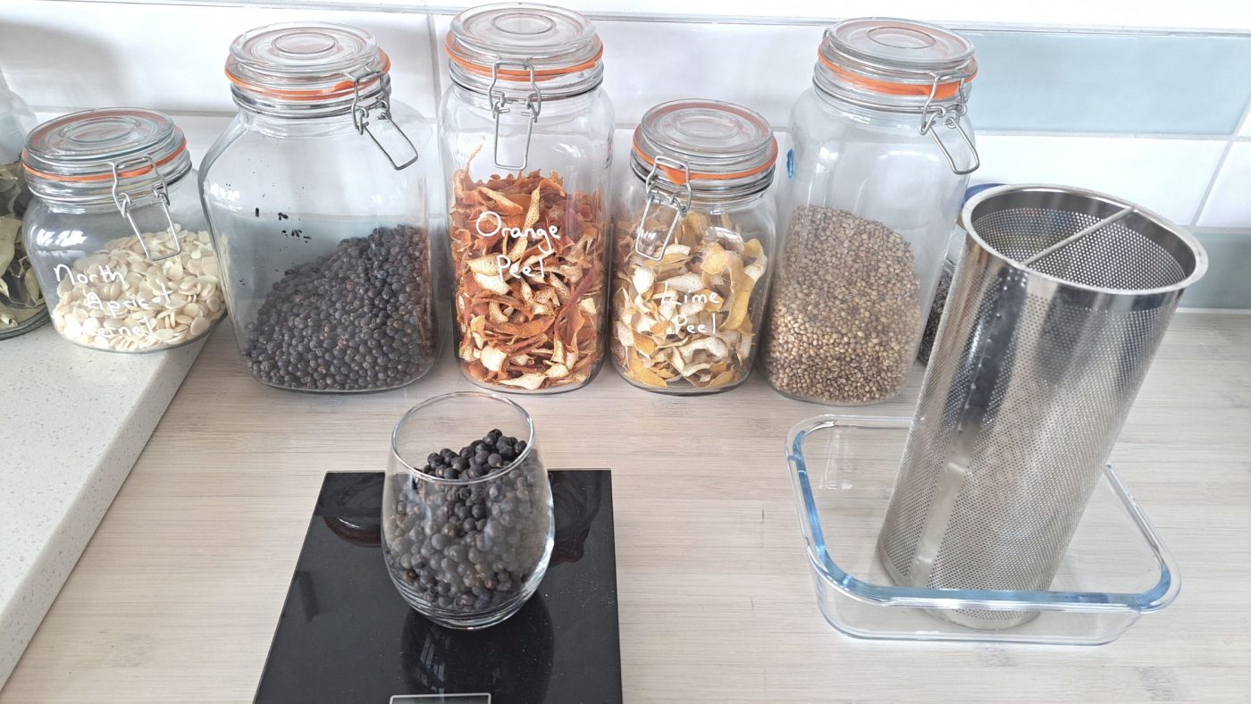 Image of DIY DISTILLING weighing ingredients to make gin