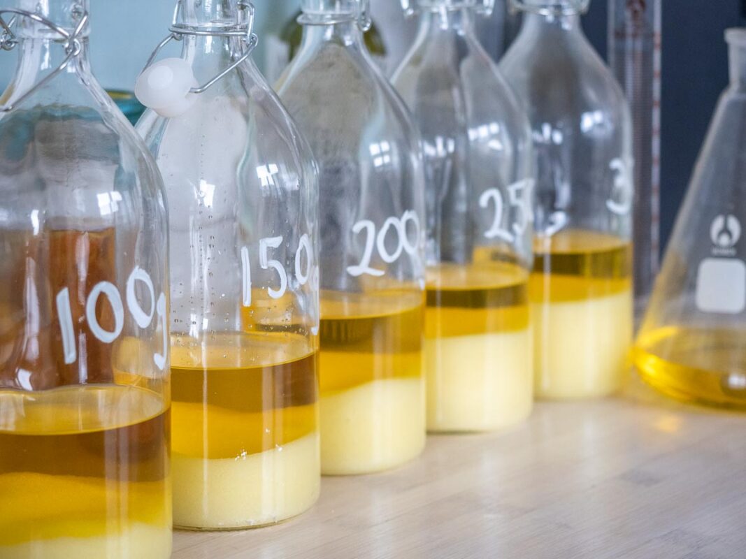 The Best Limoncello Recipe (We Tested 5 Versions!) 8 Image of DIY Distilling disolving sugar in limoncello