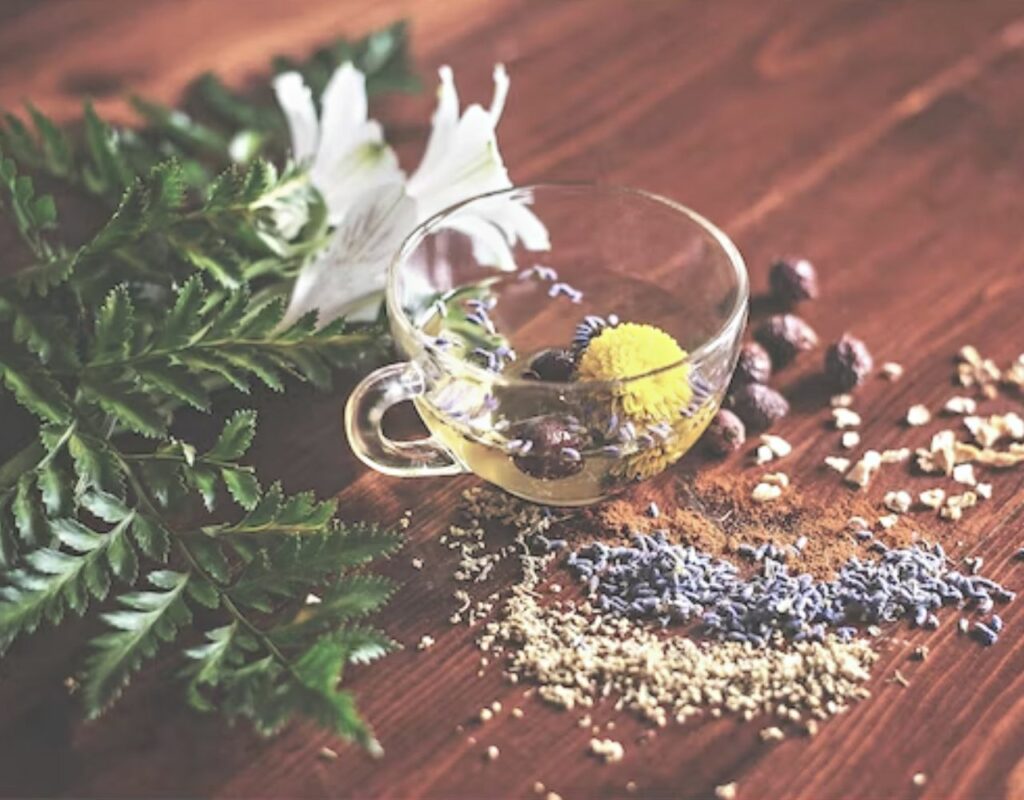 a board covered in lavendar, nutmeg and other botanicals used to make essentail oils